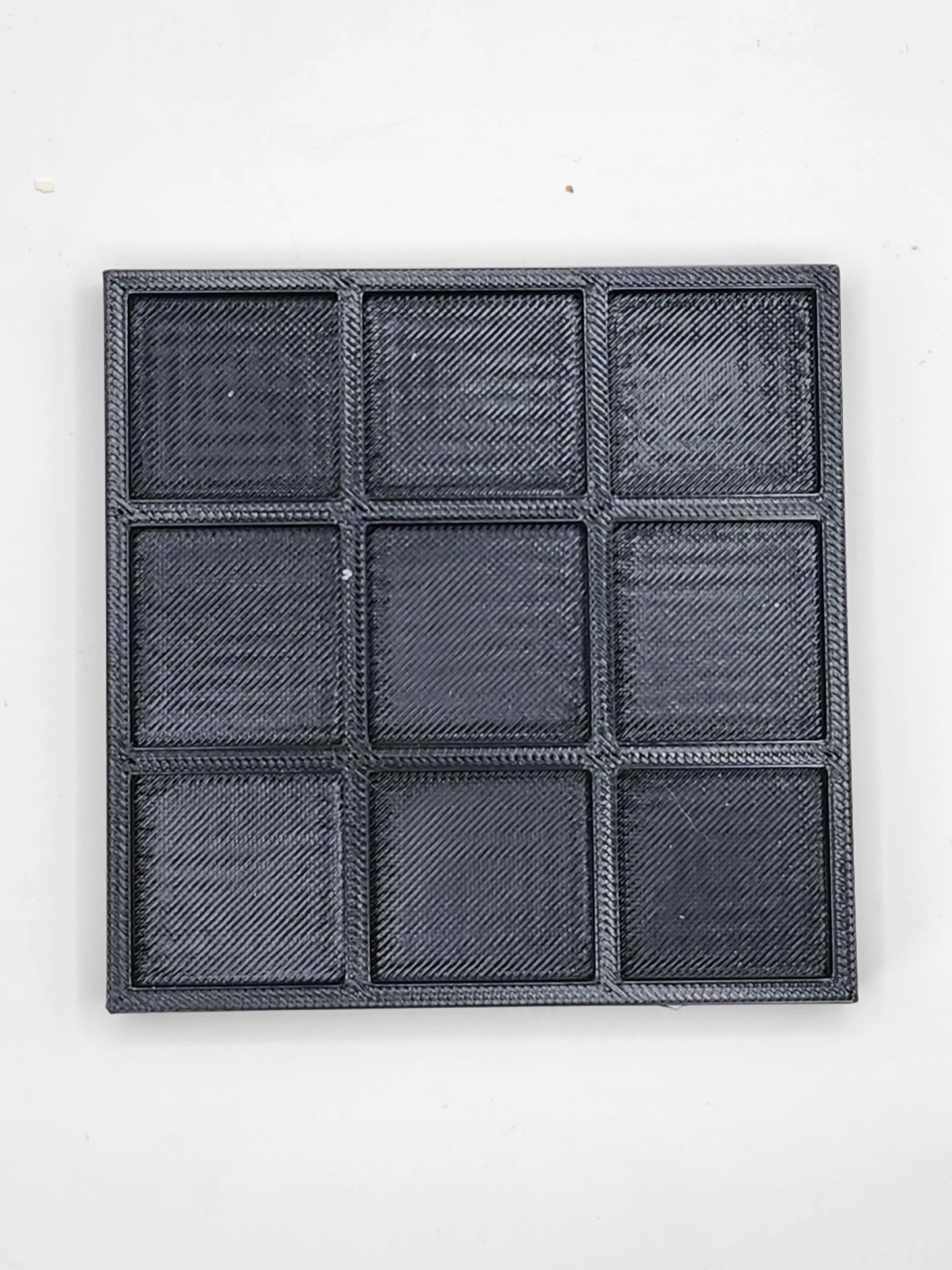 Green and Silver Tic Tac Toe Board