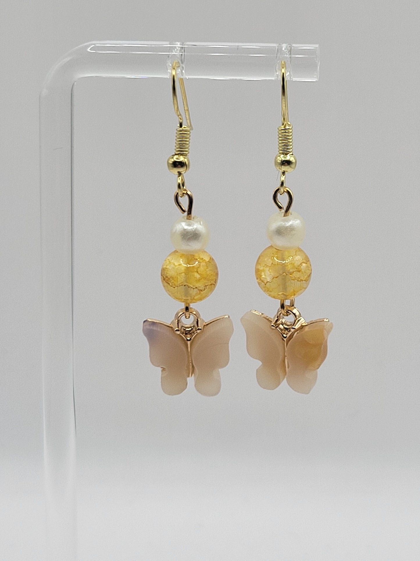 Pendientes de mariposa adornados