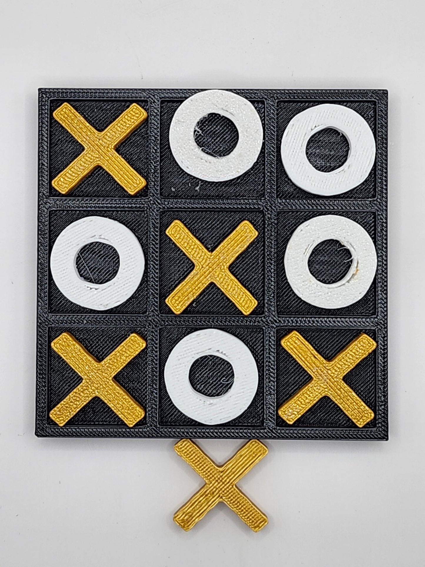 Gold and White Tic Tac Toe Board