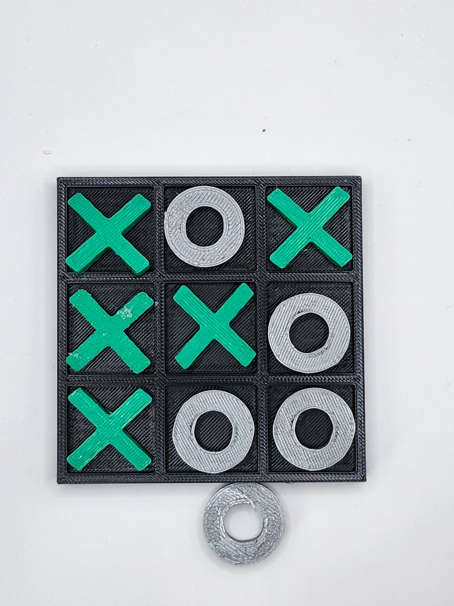 Green and Silver Tic Tac Toe Board